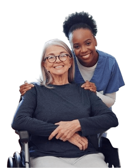A smiling elderly woman in a wheelchair with a caring nurse behind her.